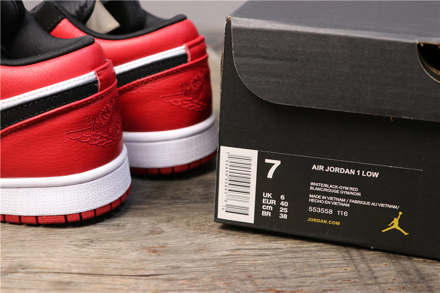 Red, black, and white low-top sneakers beside a box showing Air Jordan 1 Low, style code 553558-116, and a photographed size of EU 40.