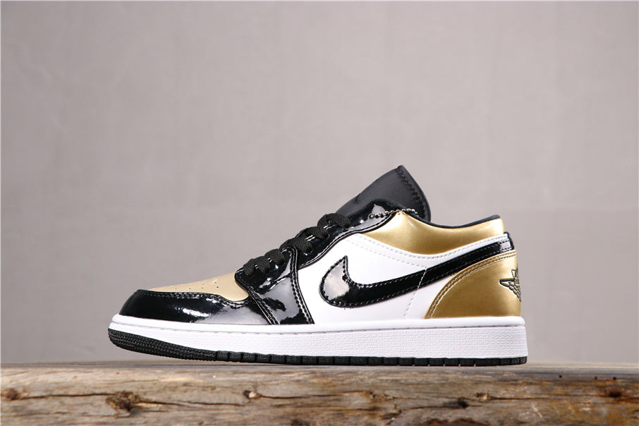 Side profile showing the black toe cap, white side panel, black detailing, metallic gold collar and rubber outsole.