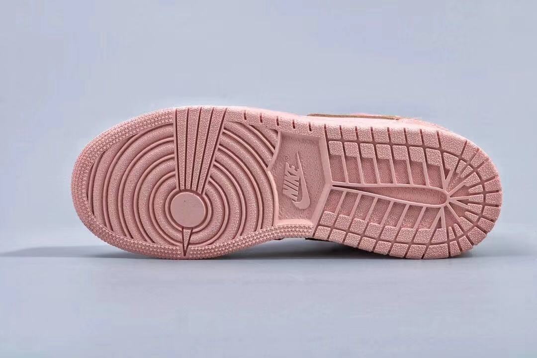 Underside view showing the pink rubber outsole and traction pattern.