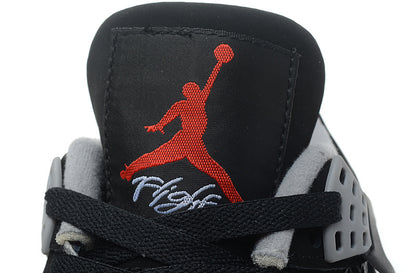 Close-up of the tongue showing red Jumpman branding and embroidered script detail.