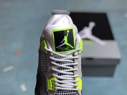 Close-up of the sneaker tongue with a black, white, and bright green Jordan Flight label.