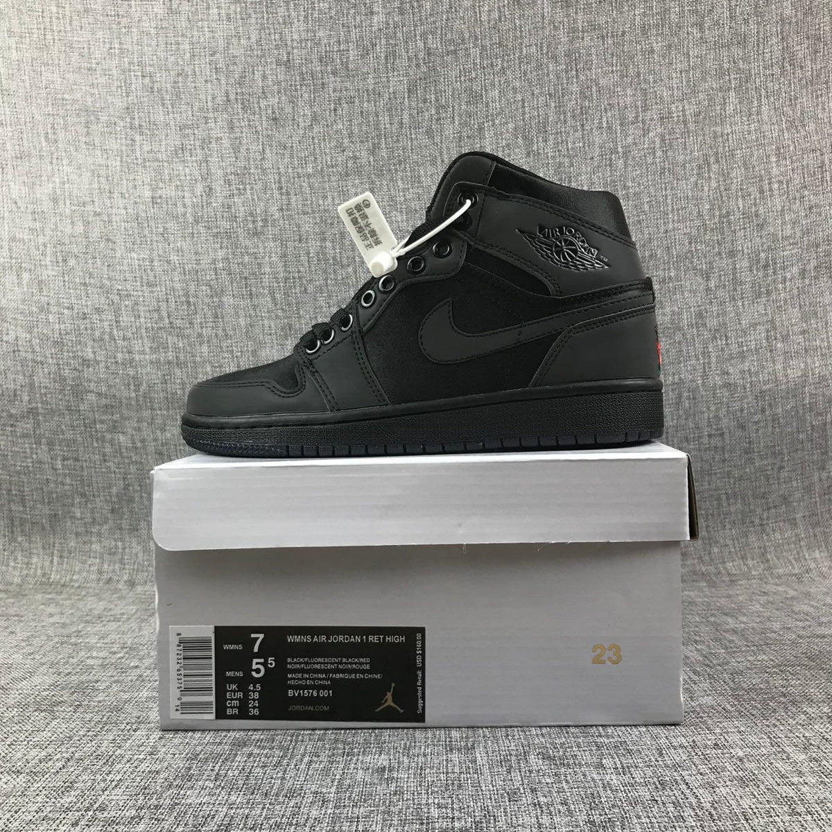 Black high-top sneaker displayed on its box; the visible label shows EU 38, women's US 7, men's US 5.5, UK 4.5, and CM 24.