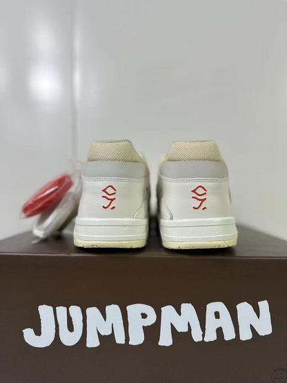 Rear view showing cream textile collars, gray heel panels, and red embroidered heel symbols.