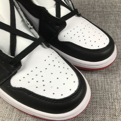 Close-up of perforations on the white toe box and black overlay