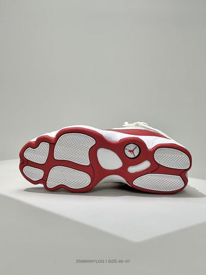 Underside view of the white and red Jordan sneaker showing the segmented outsole and Jordan logo.