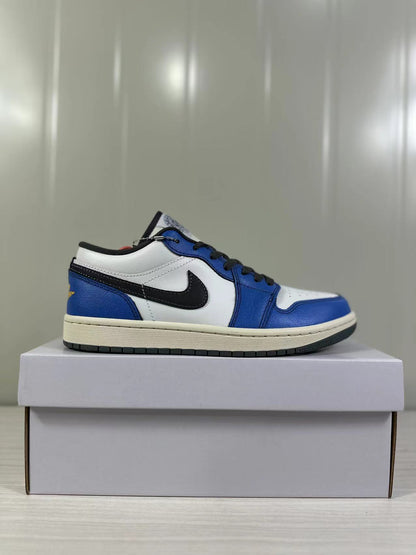 Side profile of a blue, white, and black low-top sneaker on a box.
