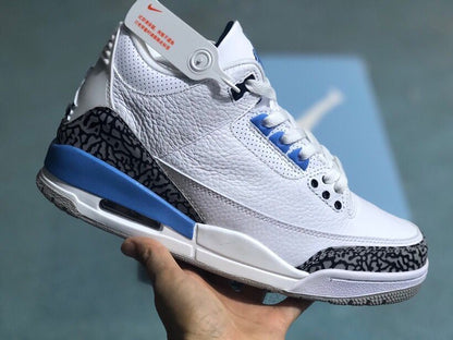 Angled view of a white and blue Jordan 3 Retro sneaker