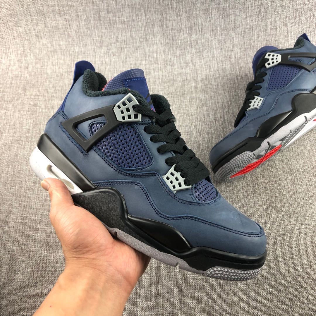 Full side view of a dark navy high-top sneaker with black overlays, white midsole, and grey outsole.