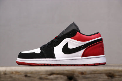 Opposite side profile of the low-top sneaker in black, white, and red.