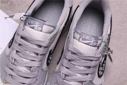 Top view of the pair showing grey laces and Dior Air tongue labels.