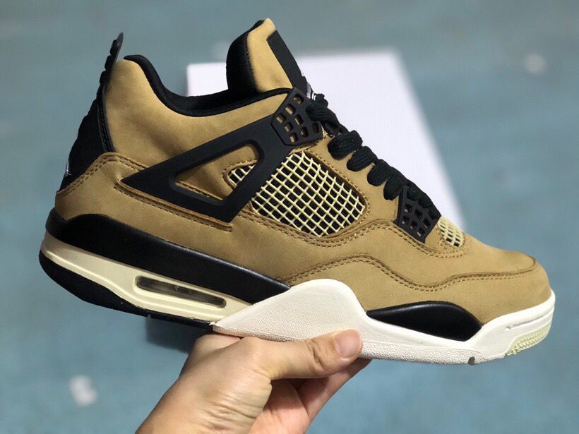Three-quarter side view of the mushroom-toned sneaker with black overlays, light mesh, and contrasting sole.