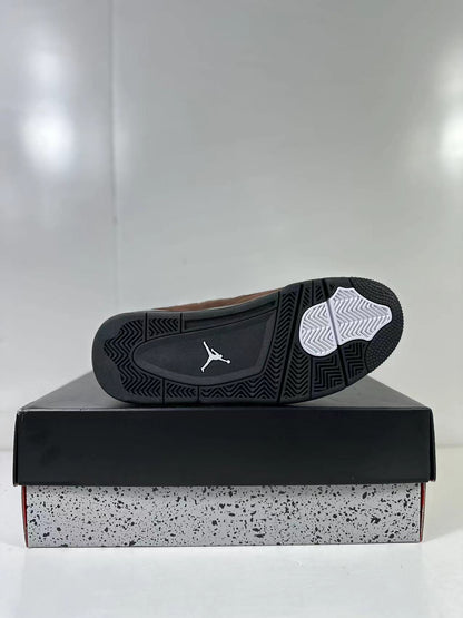 Outsole view showing a black rubber tread pattern with white traction sections and a Jumpman-style logo.