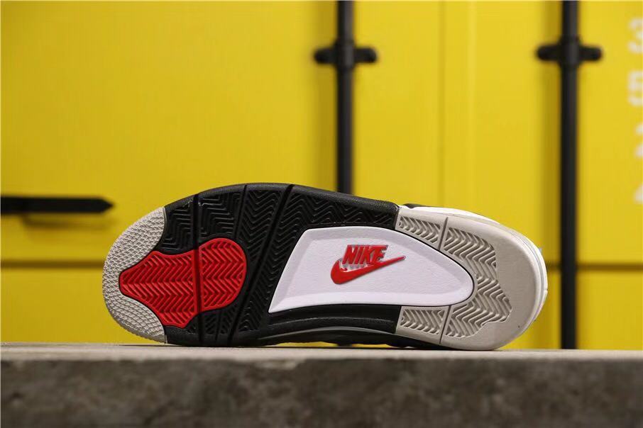 Outsole view showing black, white, and red sections with Nike branding.