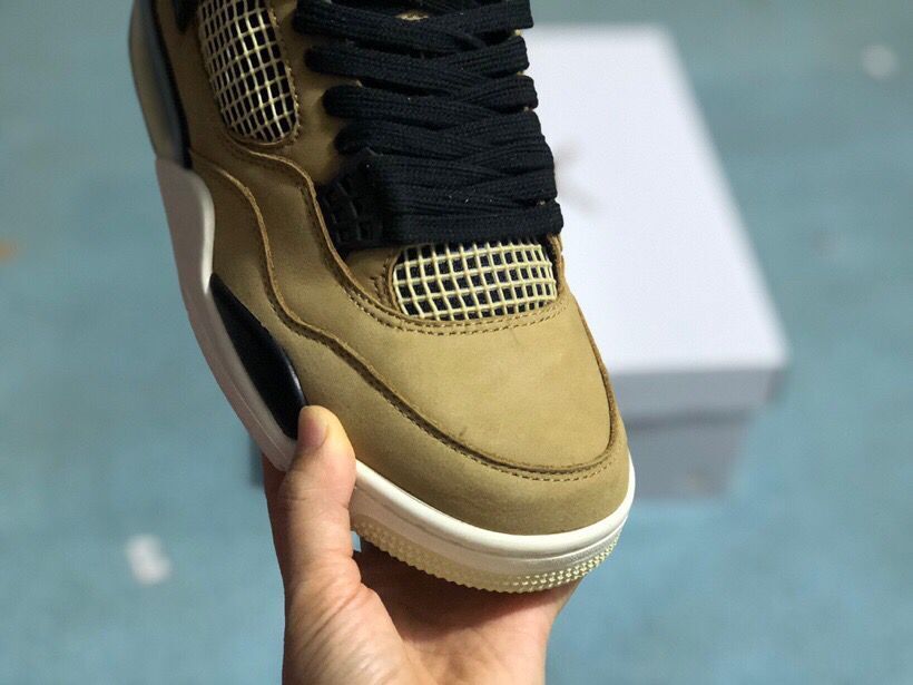 Close-up of the mushroom-toned toe box, light mesh panel, and black laces.