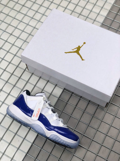 Blue and white Jordan sneaker beside a white Jordan shoebox.
