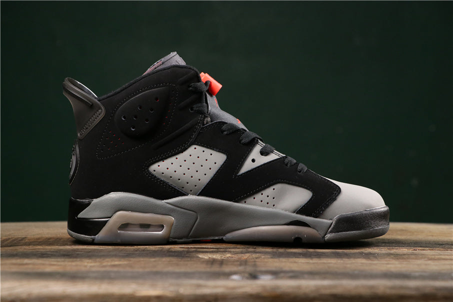 Side profile highlighting the perforated grey panels, black overlays, grey midsole, and visible heel air unit.