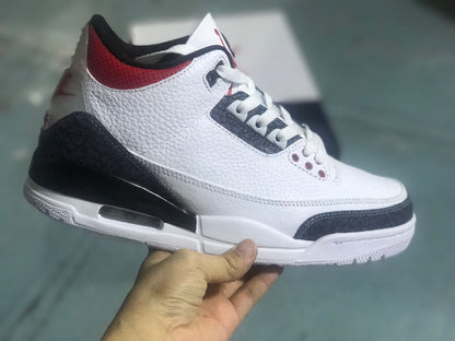 Side profile of the white, black, and red Jordan 3 Retro SE sneaker