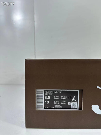 Close-up of the product box label identifying Jumpman Jack TR, color Cream Yellow, style code FZ8117 003, and photographed sizes EU 42.