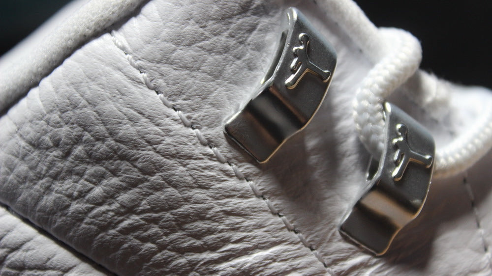 Close-up of the silver metal lace hardware with Jordan logos.