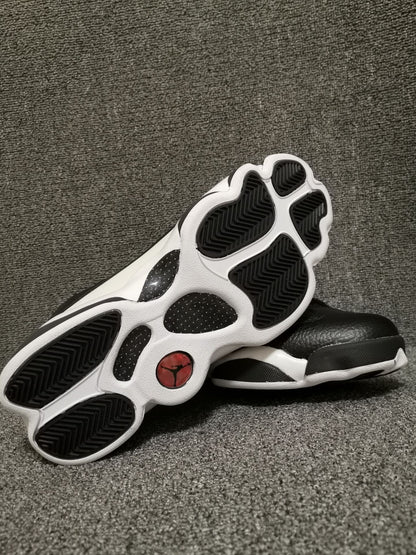 Outsole view showing black traction sections on a white base