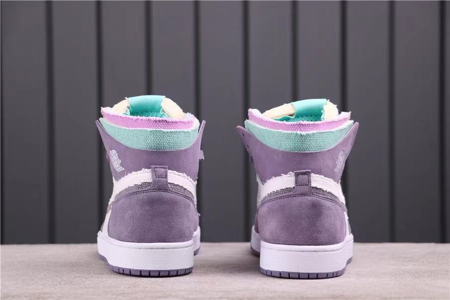 Rear view of the pair showing lavender heel panels, white midsoles and teal collar accents.