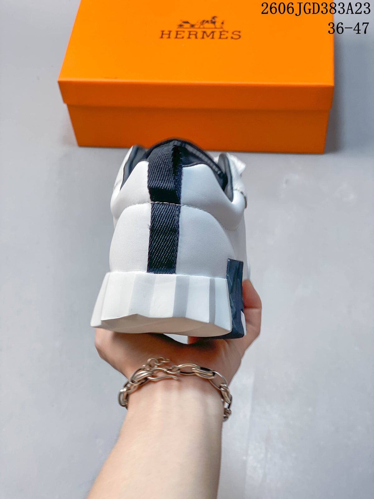 Hermès Low-Top Sneakers in White and Black
