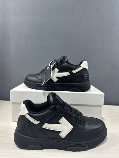 Pair of black and white sneakers shown from side and three-quarter angles, highlighting the padded collar, lace-up front, and white side detail.