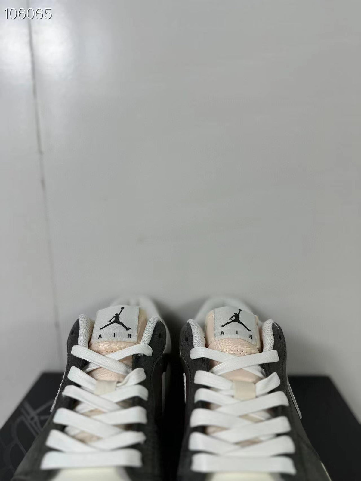 Top view of the pair showing white laces, padded collars and tongue labels with Jumpman and AIR markings.