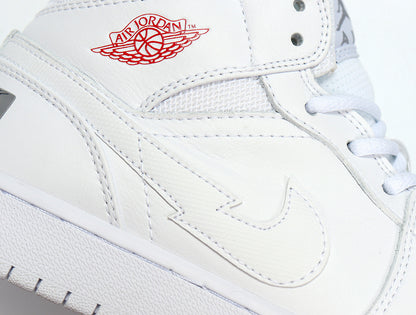 Close-up of the white upper showing the layered Swoosh detail and red wing-style branding.