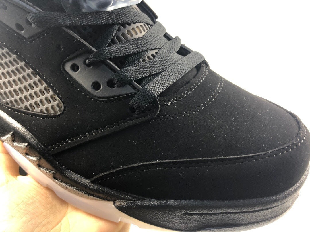 Close-up of black laces, eyelets, stitching, and the toe area.