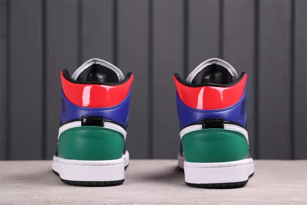 Rear view showing red and blue collar panels, green heel panels, white midsoles, and black outsoles.