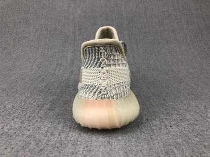 Rear view showing the knitted heel construction, padded collar, and translucent sole.
