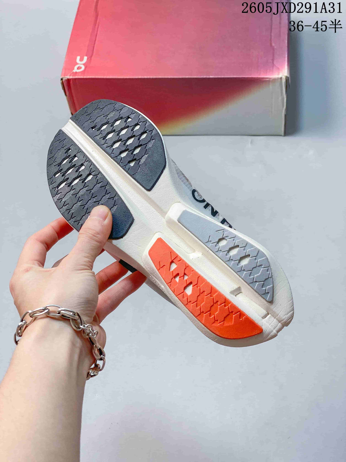 On Cloudboom Strike Running Shoes in Coral and Lilac