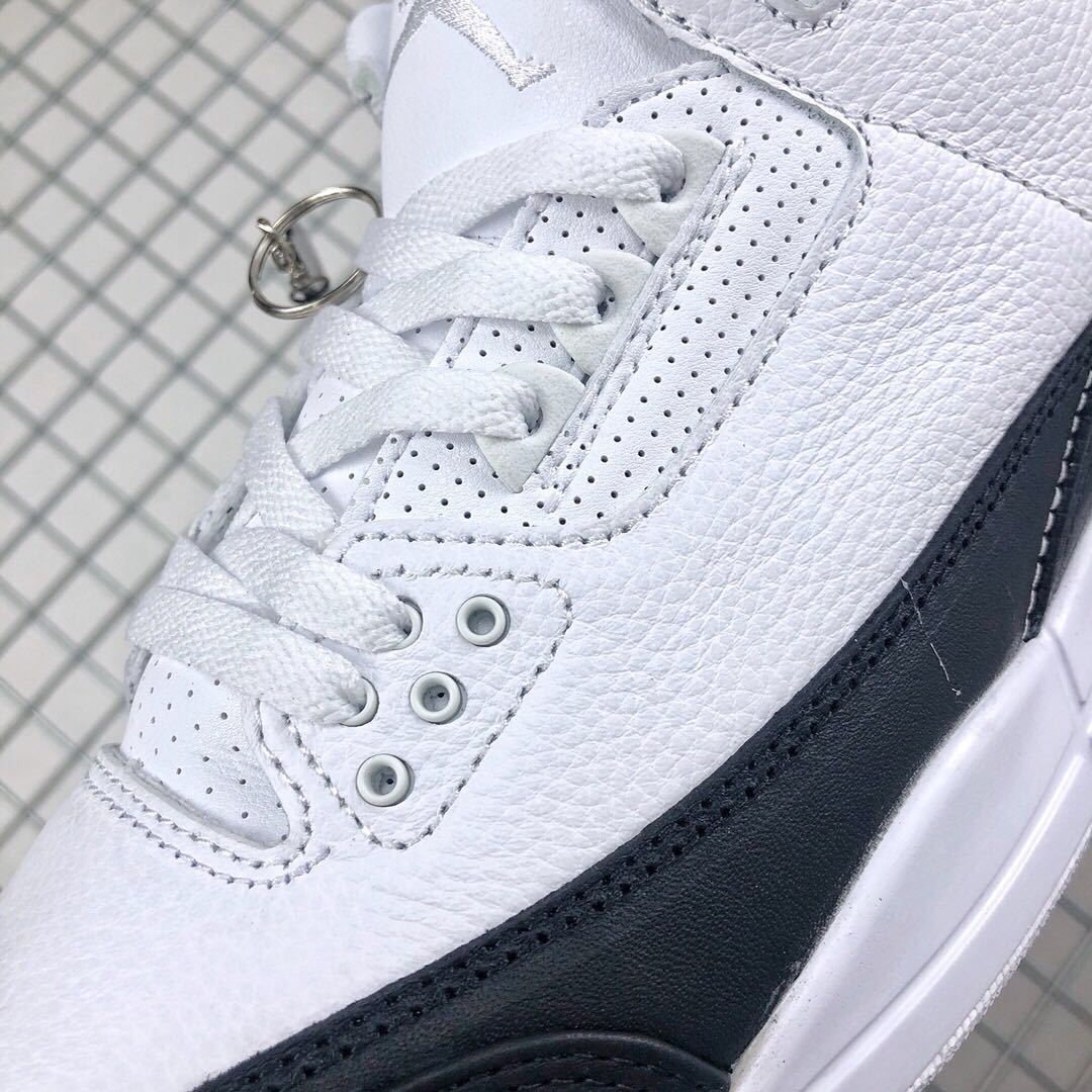 Close-up of the perforated white lace panel and black side overlay.
