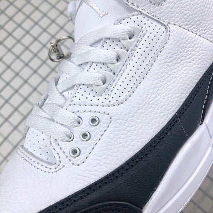 Close-up of the perforated white lace panel and black side overlay.