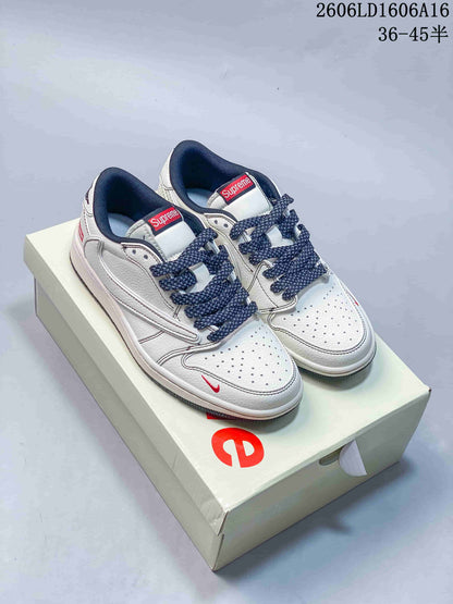 Jordan 1 Low Sneakers in White and Navy