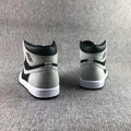 Rear view showing the black and grey heel panels and white midsoles.