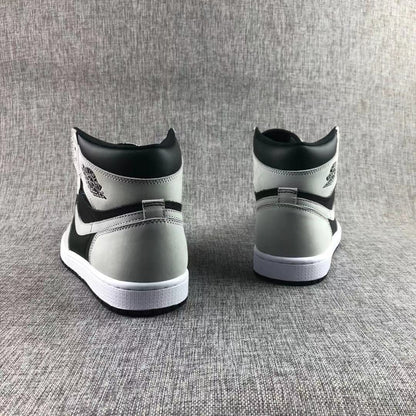 Rear view showing the black and grey heel panels and white midsoles.