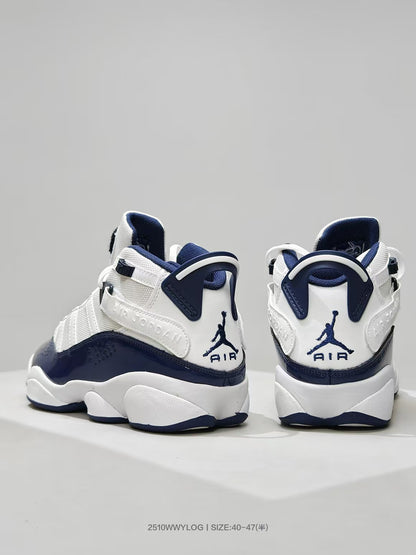 Rear view of the white and navy sneakers showing the heel branding and pull tabs.