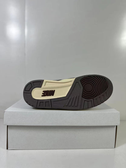 Bottom view showing the dark rubber outsole with a contrasting cream insert and Nike branding.