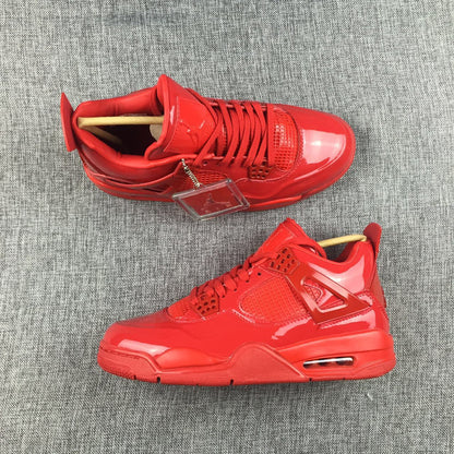 Top and side view of a pair of red high-top sneakers with matching laces and glossy panels.