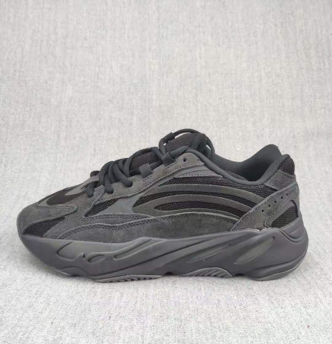 Side profile highlighting the layered panels and dark sculpted midsole.