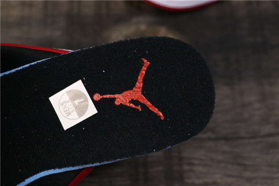 Close-up of a black insole with red Jordan branding and a small size sticker.