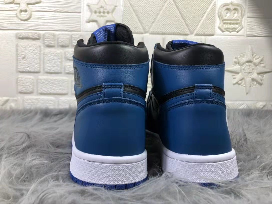 Rear view of the pair showing blue heel panels, black padded collars, and white midsoles.