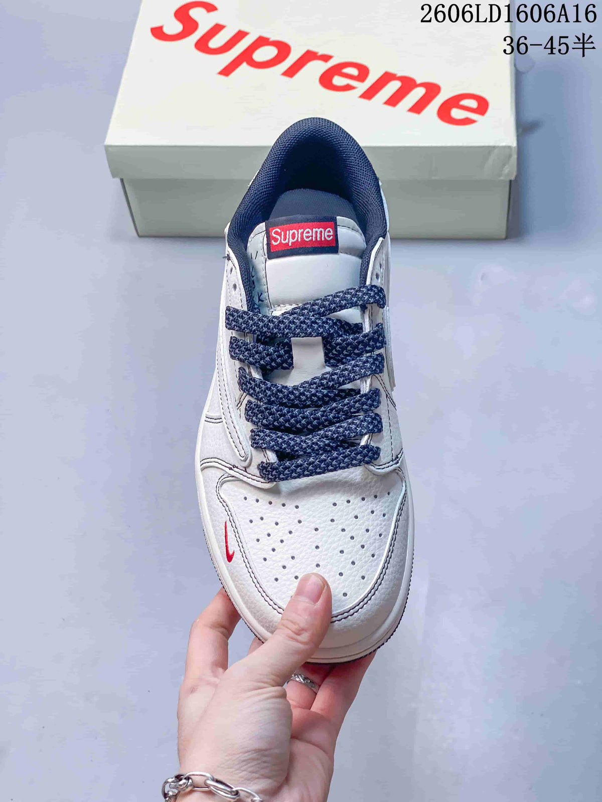 Jordan 1 Low Sneakers in White and Navy