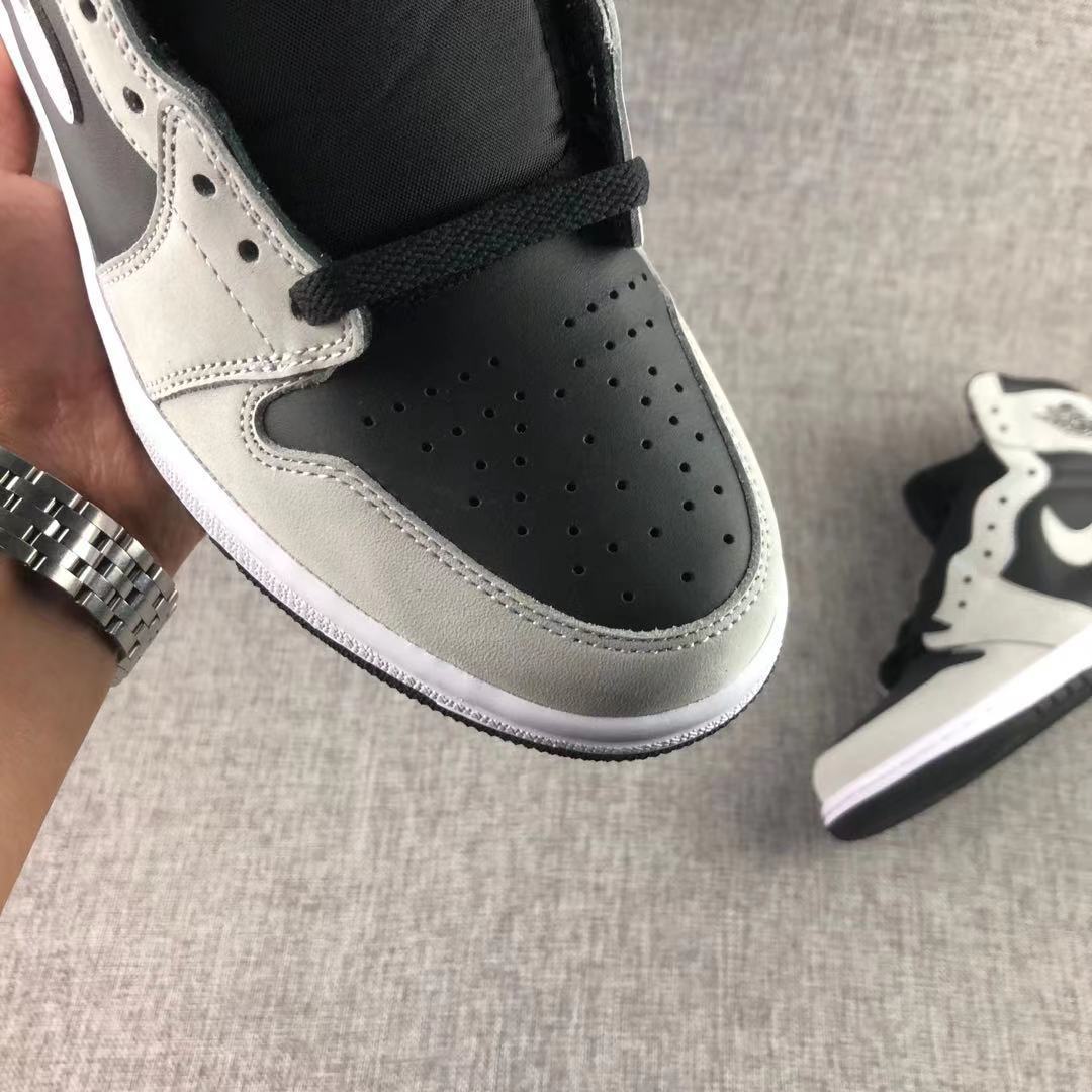 Close-up of the perforated black toe box and grey surrounding overlay.