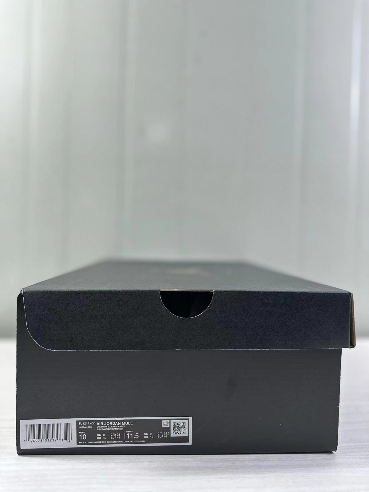 Black shoebox showing the FJ1214-400 Air Jordan Mule label and a photographed size 44 sample.