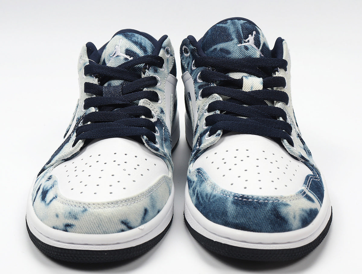 Front view of blue-and-white washed denim-look Jordan low-top sneakers with navy laces.