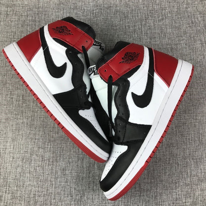 Pair of Air Jordan 1 high-top sneakers showing the black, white, and red colorway