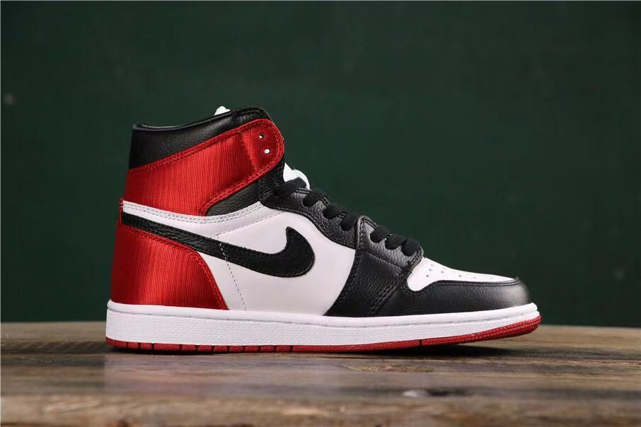 Side profile showing the high-top silhouette, red heel, black Swoosh, and white midsole.